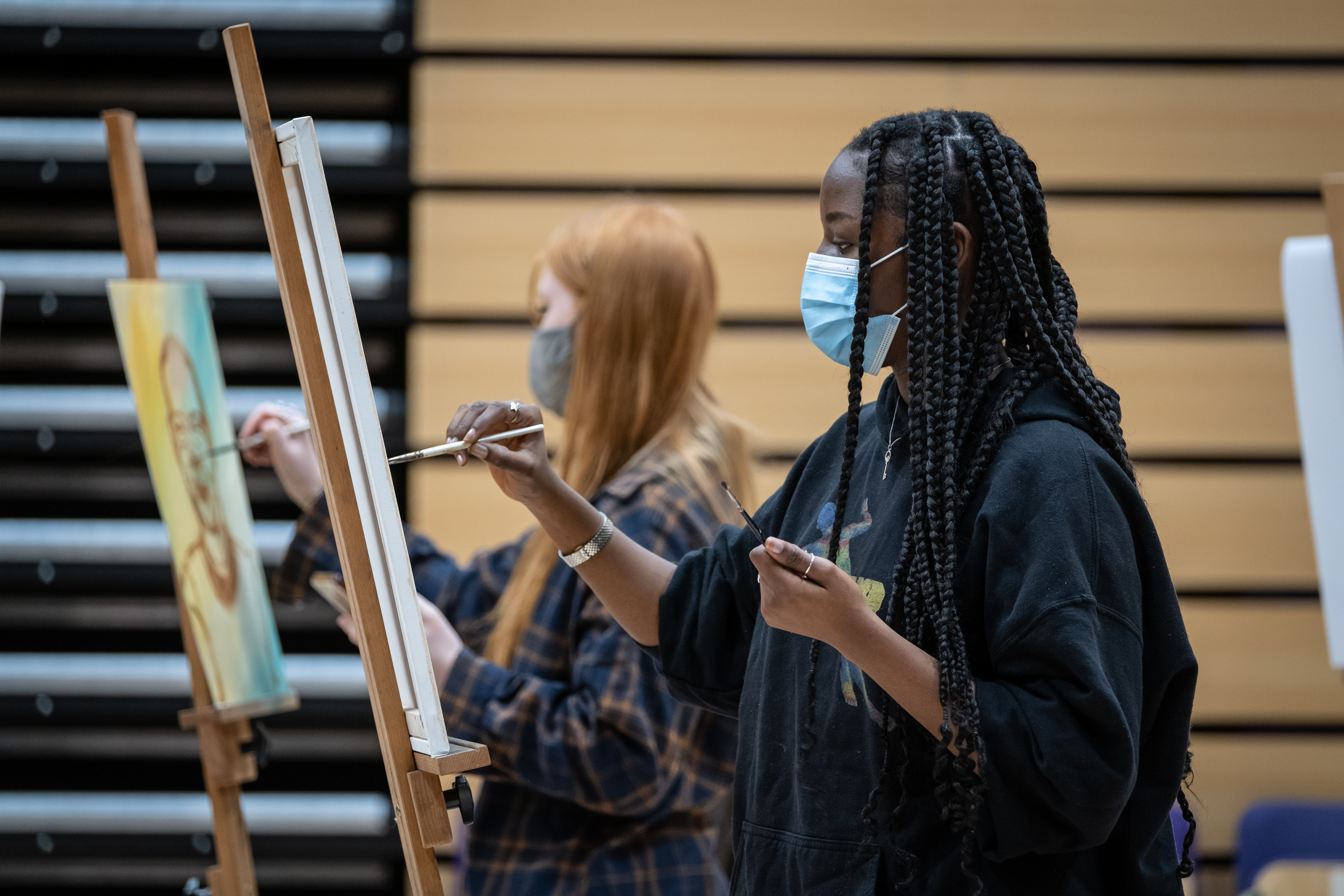 Students painting VC portrait