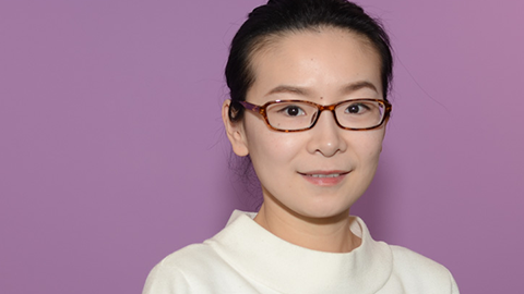 Headshot of Dr Kun Fu with purple background