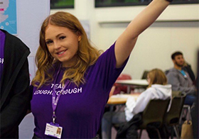 Photo of Mia wearing a 'Loughborough team' purple t-shirt