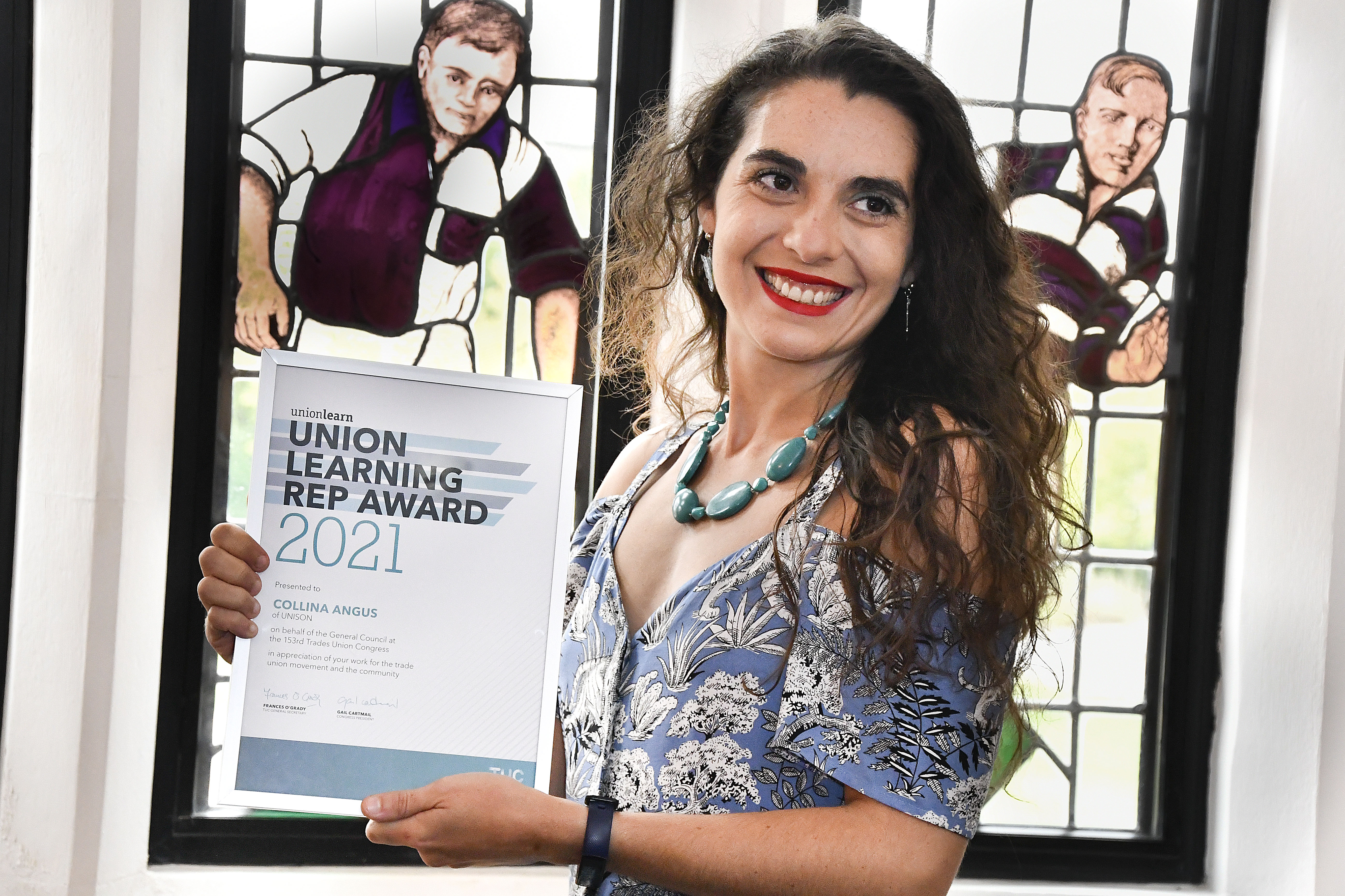 Photo of staff member Collina Angus, holding her Unison Learning Rep award certificate