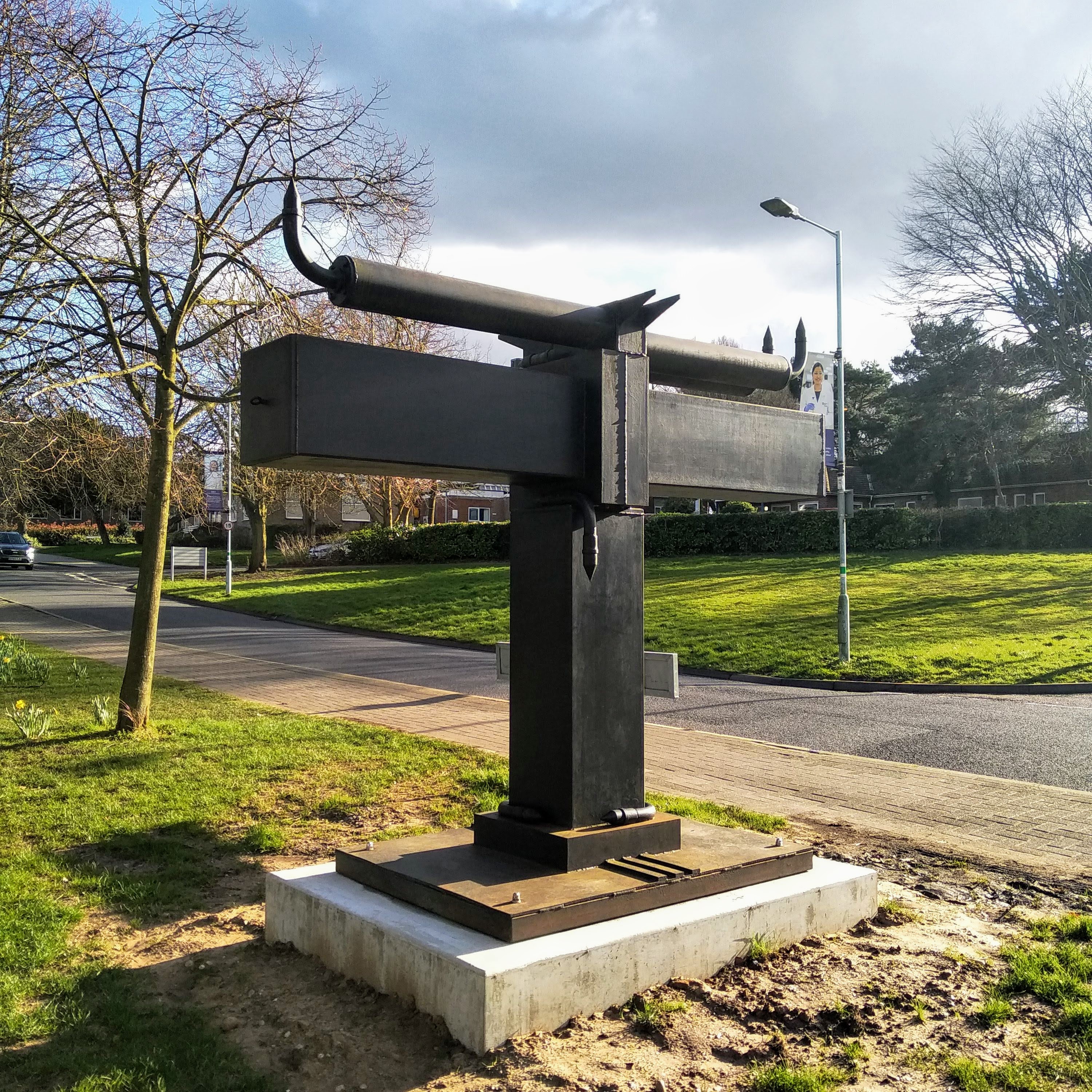 Photo of Trans sculpture by Paul Wager, located on campus