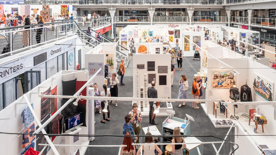 Art exhibition with people exploring the exhibits