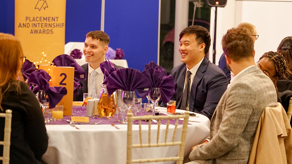 Students sitting around a table at the Placement and Internship Awards event