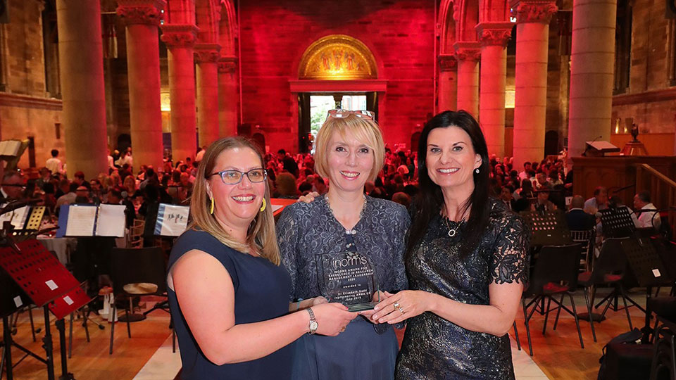 Lizzie Gadd holding her award with two colleagues at the ARMA Awards