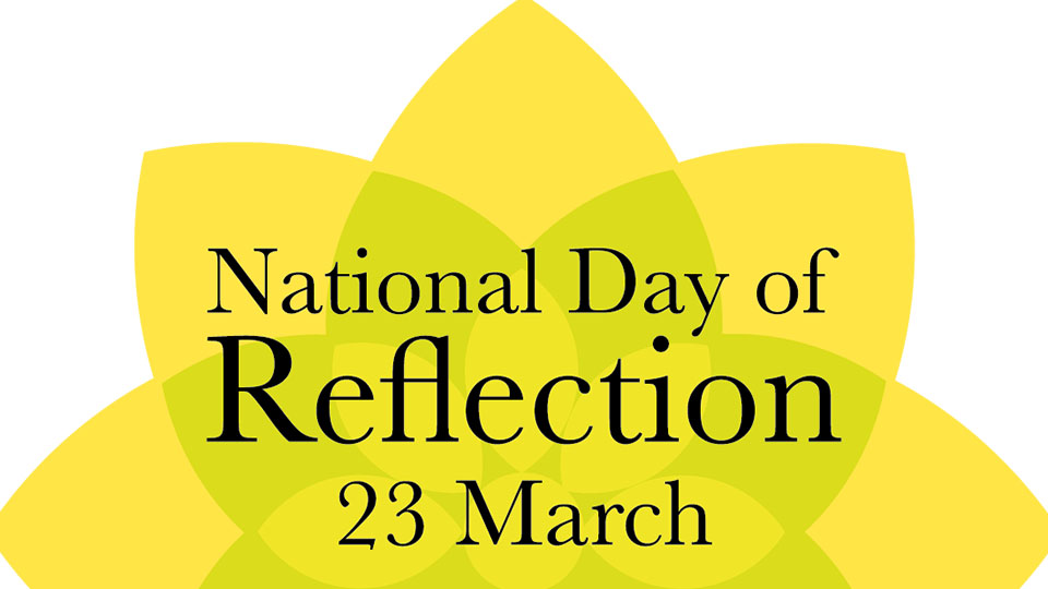 A yellow flower on a white background with the words National Day of Reflection - 23 March written over the top