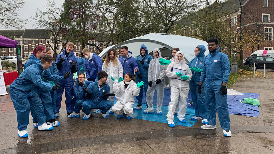 Photo of group of student volunteers outside the Students' Union after sorting through recycling and waste