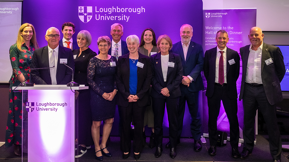 Hall of Fame inductees, SSEHS Distinguished Alumni Award recipients, the Vice-Chancellor, and other Hall of Fame members stand on stage together at the dinner