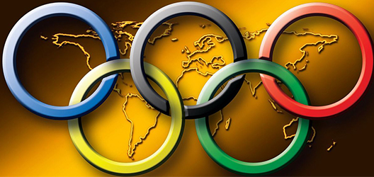 Olympic rings over an image of the world