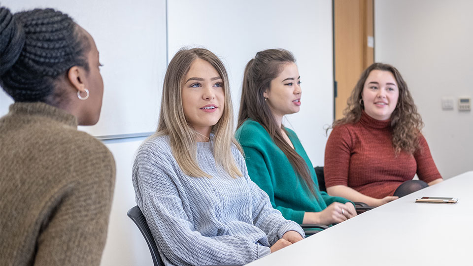 interns sat at a table 