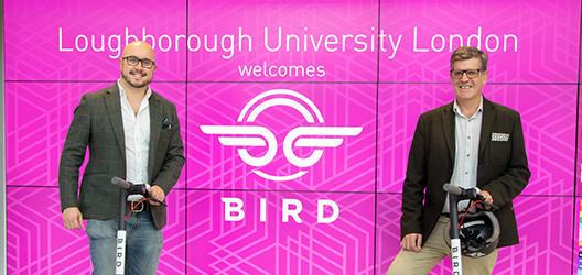 Photo of head of Bird with Loughborough University London Dean Professor David Deacon with the new scooters
