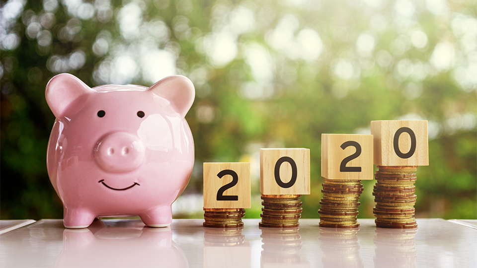 photo of a piggy bank with coins and '2020' 