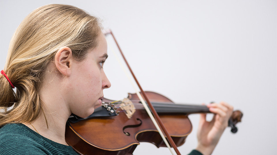 photo of a female student playing the violin