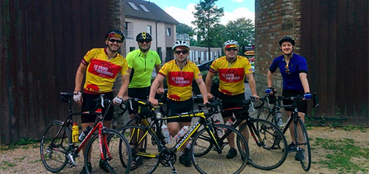 Photo of Alumni Association Chair Oliver Sidwell with team on a bike ride 