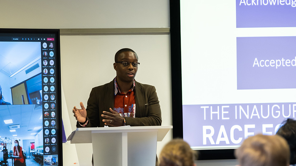 Photo of DR James Esson presenting at the Race Equity Town Hall