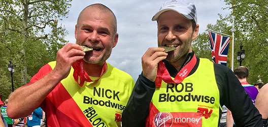 Robin and Nick with their medals after the London Marathon