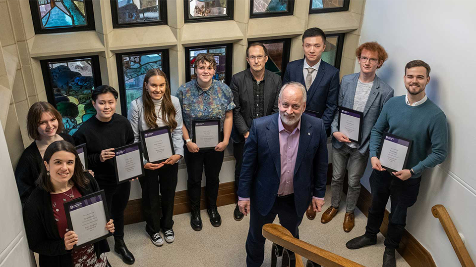 Image of scholars standing next to the Vice-Chancellor and President of Loughborough University, Professor Nick Jennings