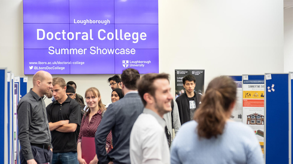 photo of stands and people talking at the 2019 Doctoral College Summer Showcase