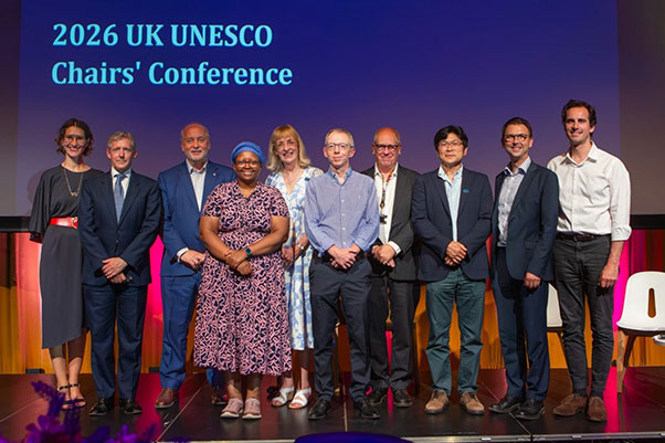 Delegates onstage including Vice Chancellor Nick Jennings and several UNESCO Chairs