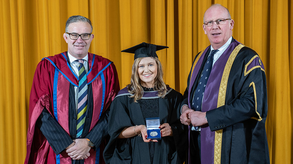 Photo of recipient last year with Professor Robert Allison