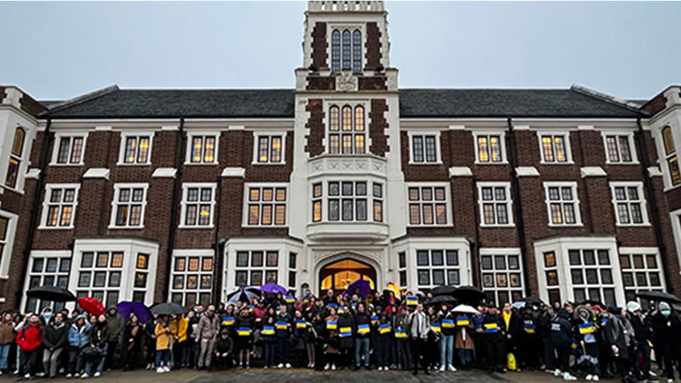 Photo of staff and students at a vigil held for Ukraine on Monday 28 Feb 2022, stood outside Hazlerigg