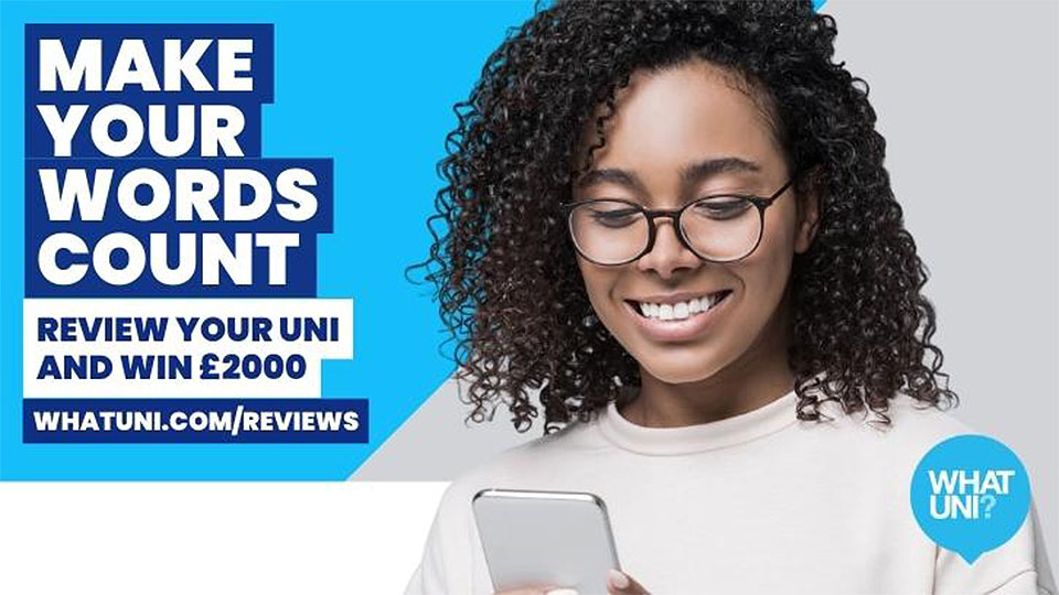 Photo of a female student with glasses and a jumper on smiling down at her phone, featuring the Whatuni logo and some words about reviewing your university