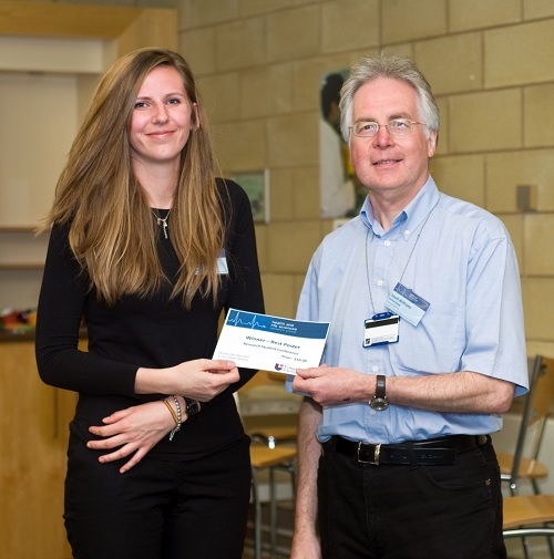 Prof. David Williams presenting Abby Paterson with first place in the Poster Competition