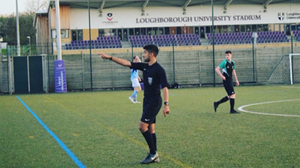 Safwan Mohammed refereeing during football match