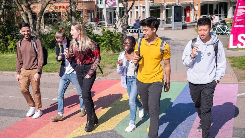 A group of students walking through Loughborough town centre