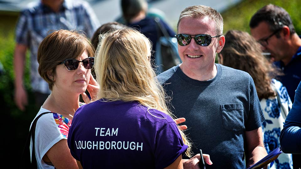 Parents talking to a Team Loughborough student on an open day